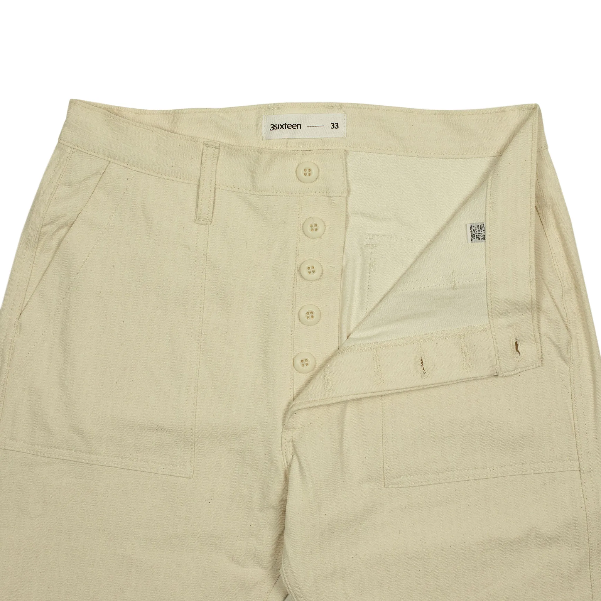 Fatigue pants in washed natural herringbone cotton