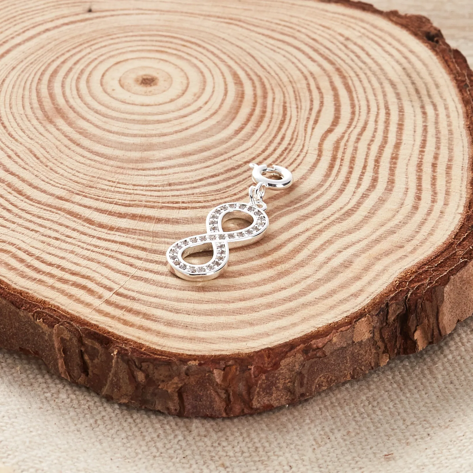 Infinity Charm Created with Zircondia® Crystals